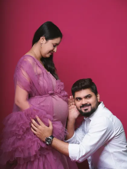 A playful and loving studio pose where the father-to-be listens to the baby bump. This is a classic and heartwarming shot that I love to capture for expecting couples.