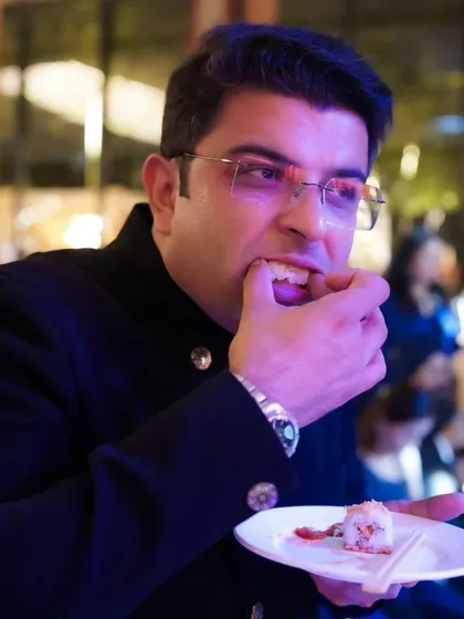 A guest enjoying the sushi at a cocktail party. I capture the full sensory experience of your event, including the fantastic food.
