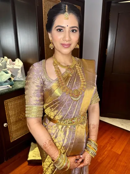 The complete engagement look, showcasing the beautiful saree, temple jewelry, and timeless makeup.