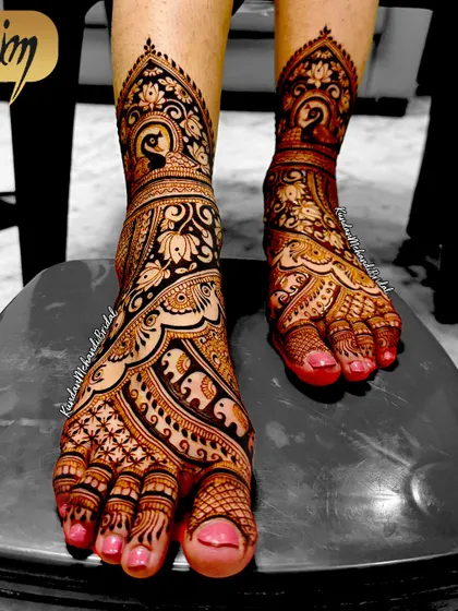 A bride's look is complete only with beautiful mehndi on her feet. This is an example of my detailed foot mehndi, featuring traditional peacock and elephant figures, which are symbols of grace and strength. The fine lines and shading show the level of detail I bring to every part of the bridal package.