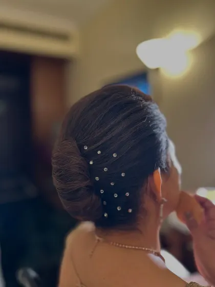 Another view of the simple yet stunning French knot with crystal pins.