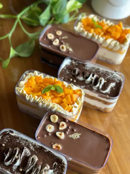 A variety of our cake tubs, showcasing the different toppings and layers that make each flavor unique.