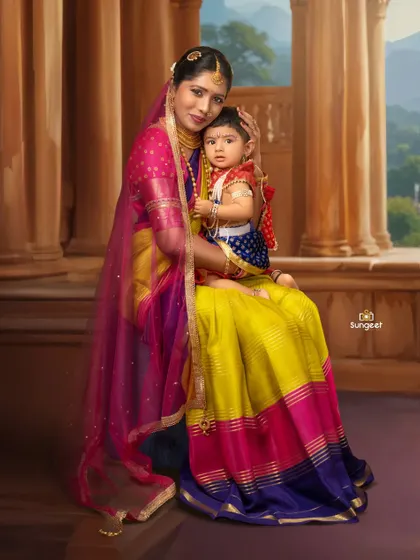 A mother and child portrait with a classic, painterly feel. Dressed in vibrant traditional clothing, they are posed against a backdrop that resembles a palace balcony, giving the image a royal and timeless quality.