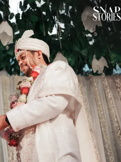 A candid shot of the groom smiling during the wedding ceremony. We focus on capturing the groom's emotions and reactions throughout the day.