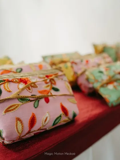 Personalized wedding favors, beautiful embroidered pouches, adding a thoughtful touch for the guests.