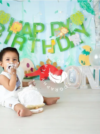 A sweet moment of enjoying the spoils. The cake is everywhere, and that's exactly what makes these sessions so memorable and fun for everyone.