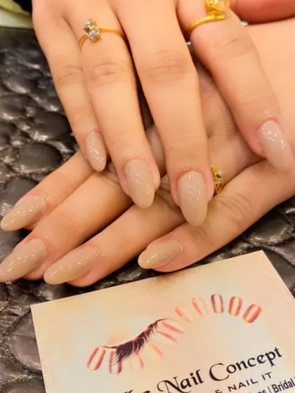 A simple and chic set of almond-shaped nails in a solid nude color. This versatile look is perfect for any occasion and complements any outfit.