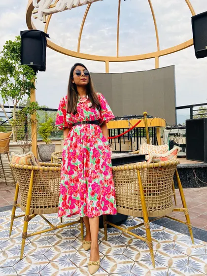 This bright pink floral dress is another great option for a day out. Here, I've added a black belt to define the waist and give it a more structured look.