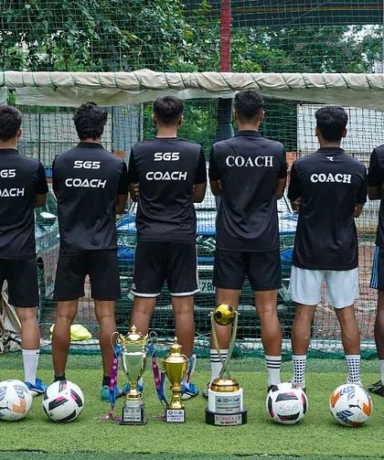 The back of our coaching team's jerseys. This image symbolizes their unity and shared mission to develop the next generation of football talent.