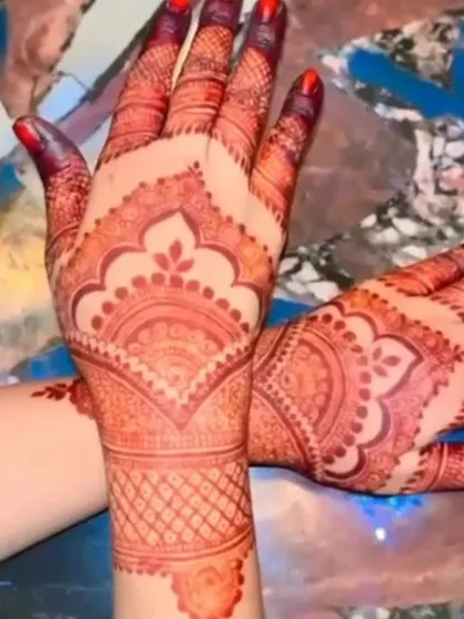 The stain on the back of the hands is just as important. This photo shows the beautiful, even color development across the entire design, with a deep red hue.