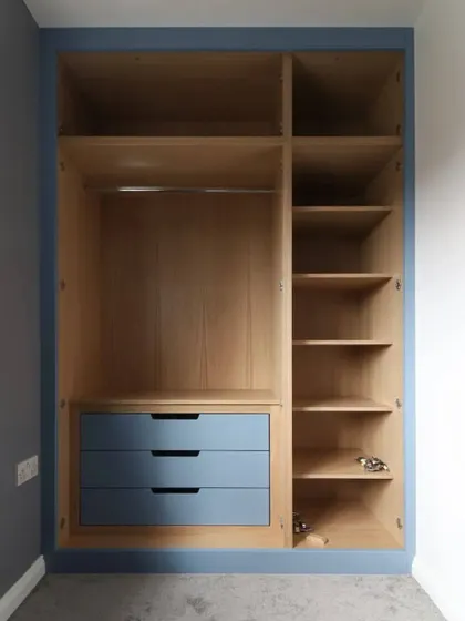 Here's a look inside one of our custom-built wardrobes. We design interiors for maximum utility, with a combination of hanging space, adjustable shelves, and drawers, ensuring every inch of your storage is functional and tailored to your needs.