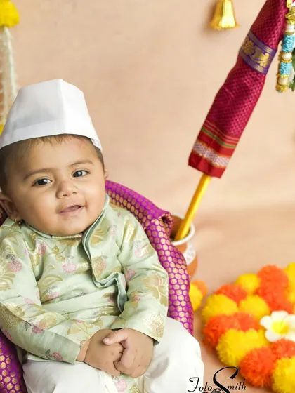 Celebrating the Maharashtrian new year with a Gudi Padwa themed shoot. This little one, dressed in a traditional kurta, looks so charming next to the Gudi.