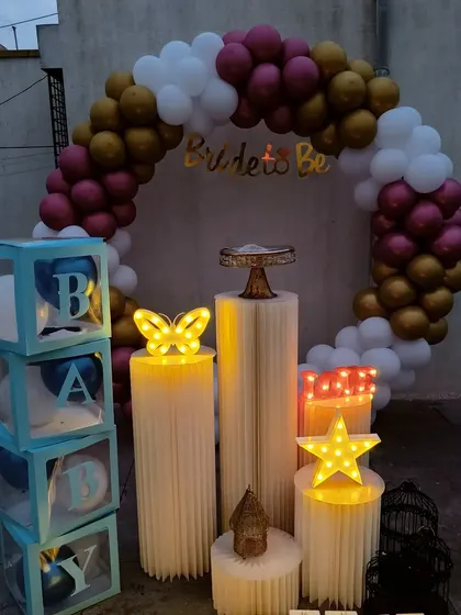A versatile balloon ring setup in maroon, gold, and white, shown here for a "Bride to Be" event but easily adaptable for a baby shower.