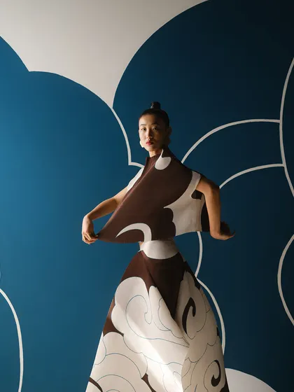 A look from the Payal Khandwala campaign featuring a cloud-like print. The styling is about creating a strong, dance-like pose that complements the graphic nature of the print and the set.