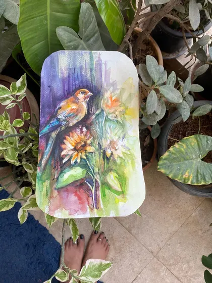 A watercolor painting of a bird perched among sunflowers, set against the backdrop of my own balcony garden. A vibrant piece to start the week with a bang.