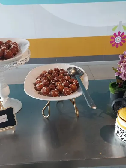 A delicious spread of Gulab Jamun served at a corporate lunch. We use elegant serveware to present our food, adding a touch of class to any event.