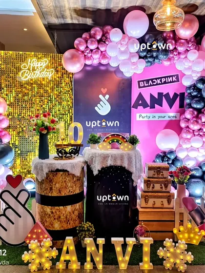 A K-Pop Blackpink themed birthday party with a gold sequin backdrop.
