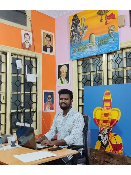 Me at my desk in the studio. Every portrait you see on this page was created right here in this room.