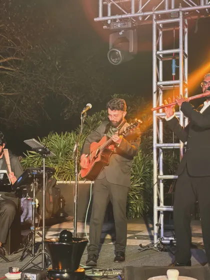 Flute joins our guitar and percussion on the outdoor corporate stage at JW Marriott Bengaluru Golfshire.