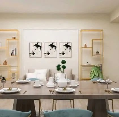 A close-up of the elegant dining area concept, highlighting the gold-framed shelving and modern artwork that complete the sophisticated look.