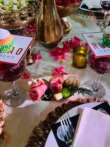 It's all in the details. For this 75th anniversary, we created a sophisticated tablescape featuring individual charcuterie servings, fine wine, and custom-branded cupcakes placed elegantly on each glass.