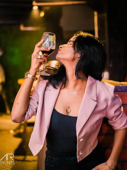 A guest enjoying a glass of wine.