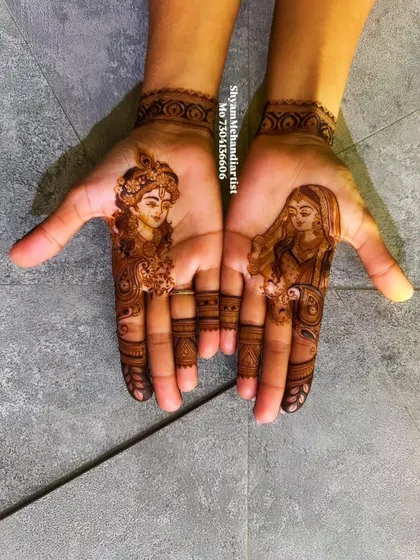 A finished set of portraits featuring Lord Krishna and Radha, each intricately detailed on the palms.