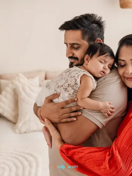 In this quiet moment, a new family of three shares a hug. These unposed, candid shots are often the most powerful, showing the deep connection and love you share.