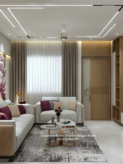 A comfortable and stylish living room with a neutral sofa, patterned cushions, and a simple, functional TV unit. The design is perfect for everyday living.