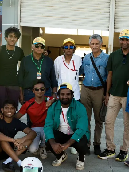 A group photo with drivers, parents, and team members. The support system off the track is just as important as the work done on it, and we are grateful for our entire community.