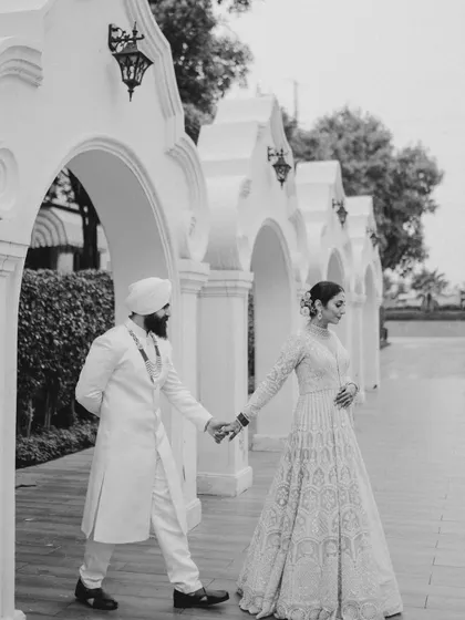 A timeless black and white shot of a Sikh couple on their wedding day. We planned and decorated their beautiful Anand Karaj ceremony at Sarovar Premiere, Gaur City.