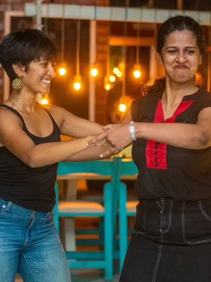 Two friends making funny faces while dancing. It’s a reminder that dance is about having fun and being yourself.