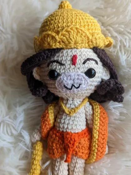 The Hanuman doll against a soft, white background.