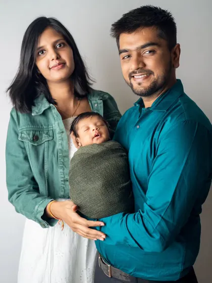 The first official family portrait. We love capturing new parents as they hold their baby together, documenting the start of their journey as a family of three.