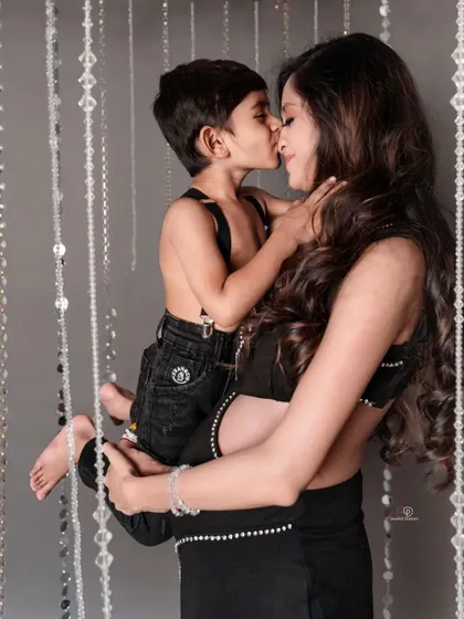A tender kiss from the big-brother-to-be. These are the precious, unscripted moments that make a family maternity session so meaningful.