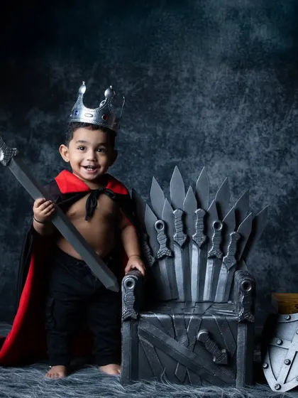 A joyful king standing proudly next to his throne, ready to lead his people.