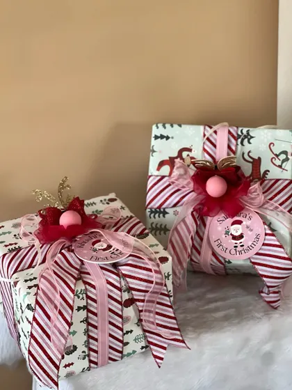 A baby's first Christmas is so special. I wrapped these gifts in festive paper and finished them with beautiful striped ribbons and a 'Samaira's First Christmas' tag.
