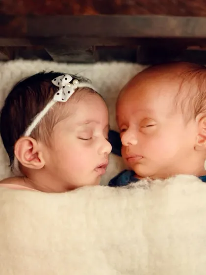 Capturing the bond between twins is twice the magic. Here, I posed them nose to nose, showing their connection and comfort with each other, even while they sleep.