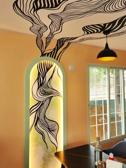 A close-up of one of the fiber moulded alcoves, where the material provides a textured surface for our art and interacts beautifully with the backlighting.