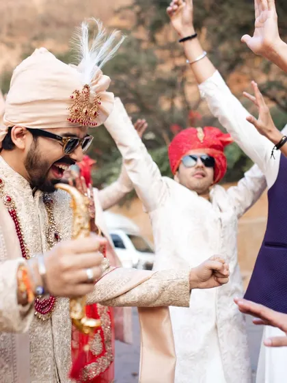 The groom and his squad, full of energy and ready to dance their way to the wedding. The baraat is a celebration in itself, and I make sure it's an unforgettable party.