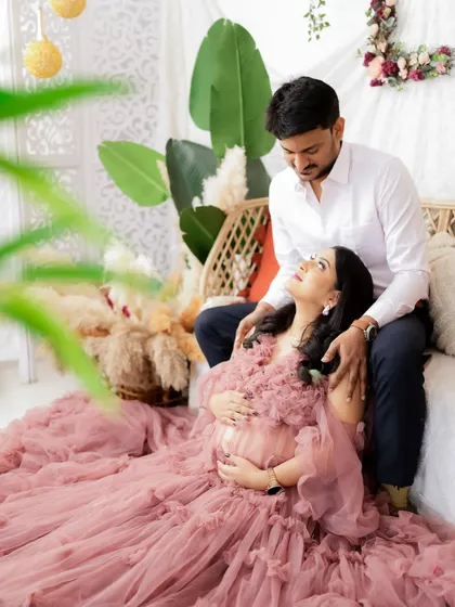 A romantic moment in a boho-chic setting. The couple is lost in their own world, creating a beautiful and intimate portrait.