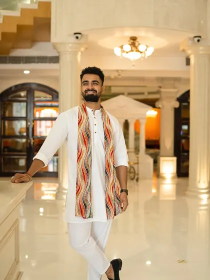 Standing tall in a grand hotel lobby. The environment inspires my performance.