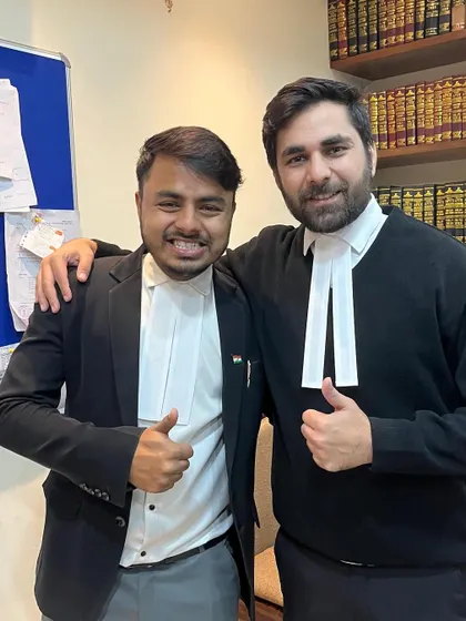 A good day in court. My colleague and I after a successful hearing. We're not just a team, we're partners in fighting for our clients' rights.