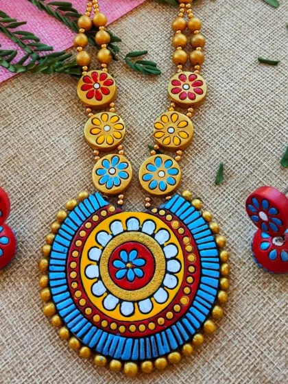 This version of the floral mandala necklace comes in a striking combination of blue, red, and yellow. It's a vibrant piece perfect for Navratri and other colorful festivals.