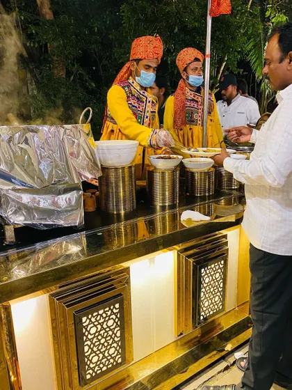 A guest being served at a themed counter. The attention to detail in my staff's uniform adds an authentic touch to the overall experience.