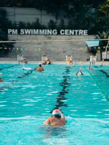 Our training isn't just for kids. Here, an adult swimmer practices their form in one of our dedicated lanes. We offer a supportive, judgment-free environment for adults to learn, improve their strokes, and build water confidence.