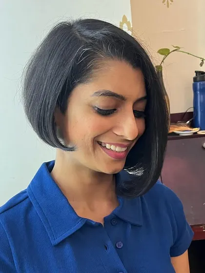 Deepika looking happy with her new short style.