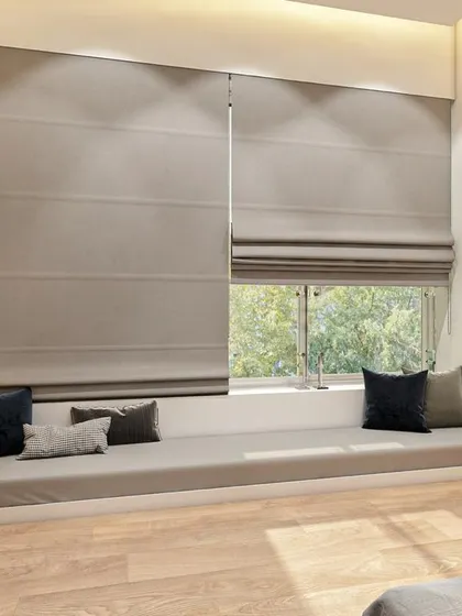 A cozy reading nook created from a bay window, complete with a comfortable mattress and plush cushions.