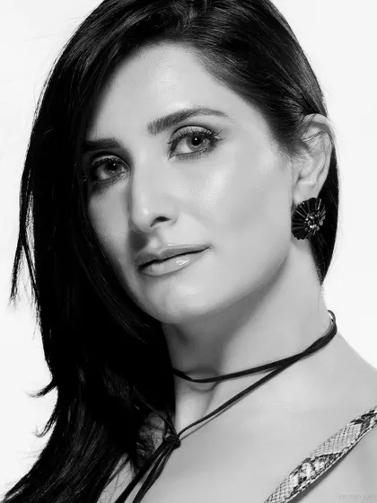 A classic black and white beauty headshot. The clean lighting and direct gaze make for a powerful and timeless portrait.