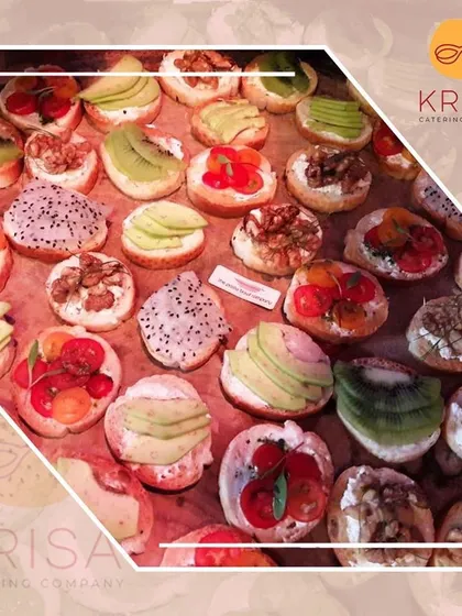 A colorful assortment of our fruit and vegetable bruschetta. Toppings include avocado, kiwi, cherry tomatoes, and dragon fruit, providing a vibrant and healthy option for guests.